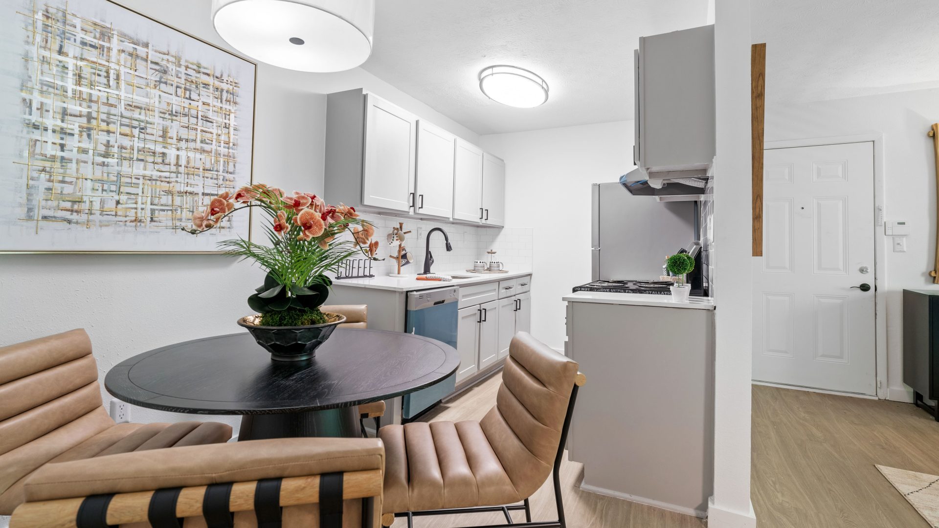 a kitchen and dining room area with a table and chairs at The  Wynne