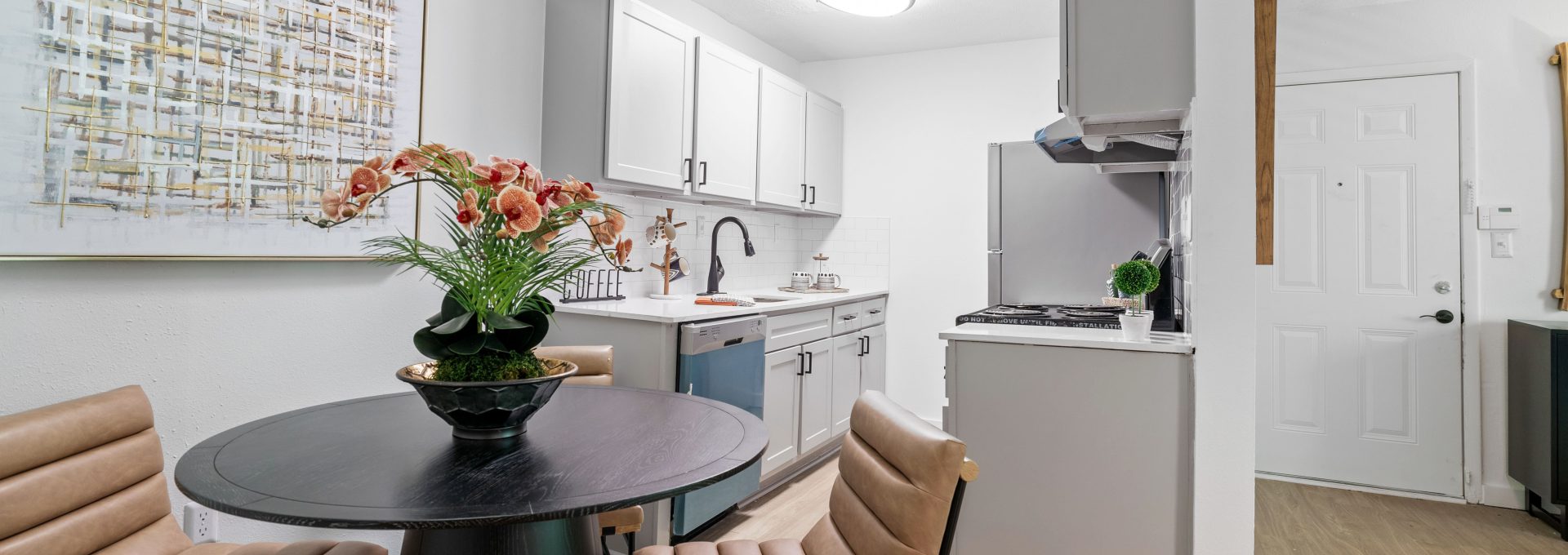 a kitchen and dining room area with a table and chairs at The Wynne