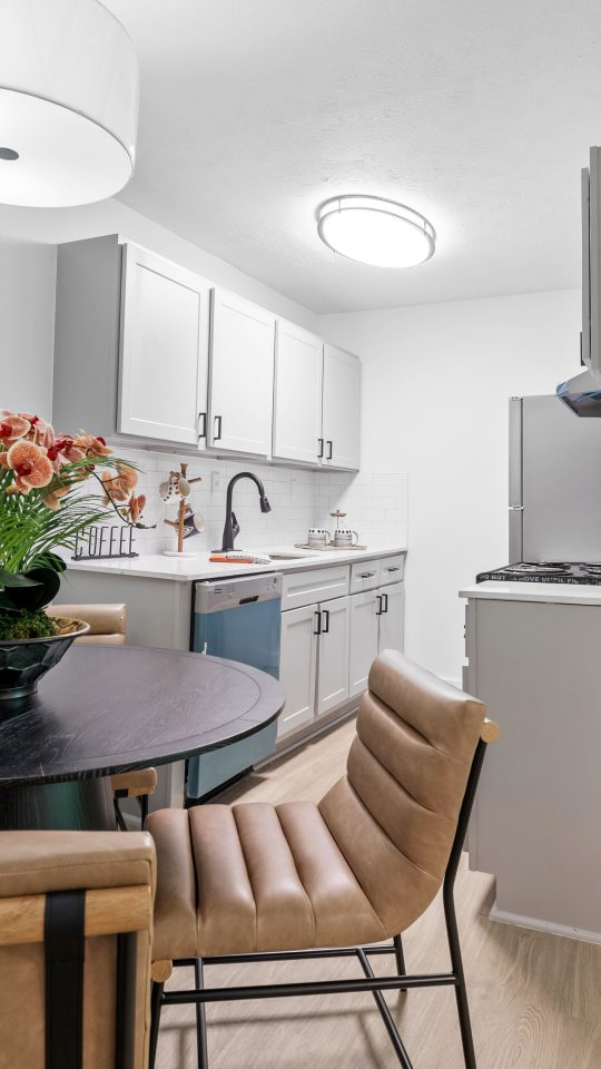 a kitchen and dining room area with a table and chairs at The Wynne