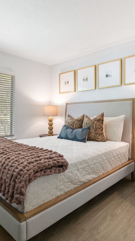 a bedroom with hardwood floors and a large bed at The  Wynne