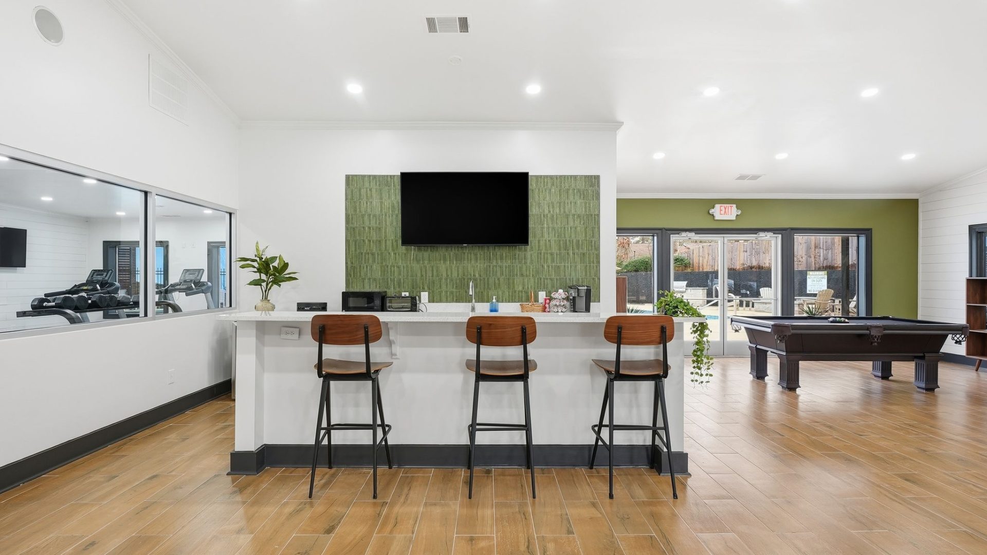 a living room filled with furniture and a tv