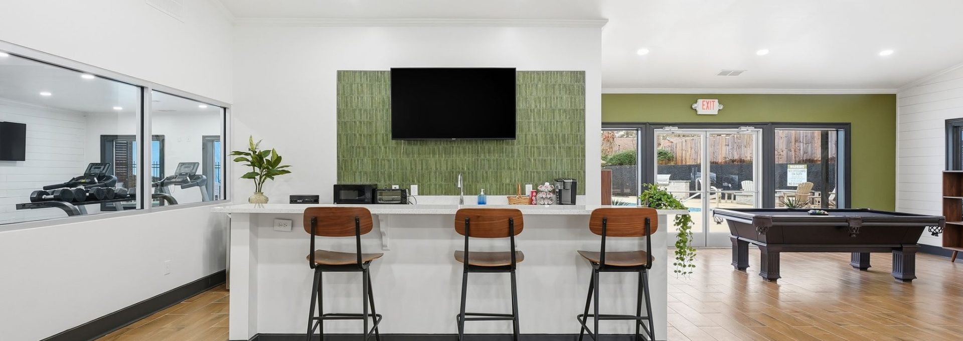 a living room filled with furniture and a tv