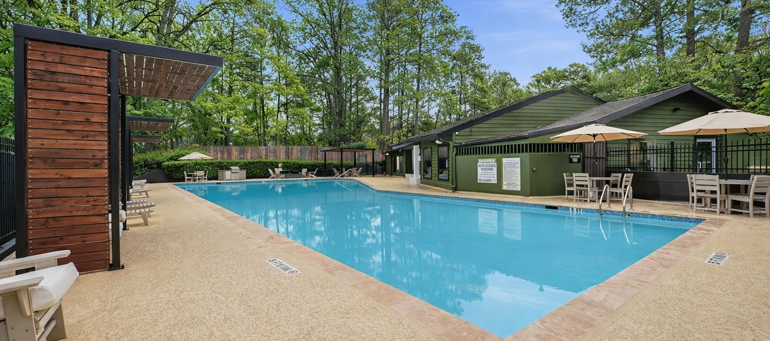 a pool with a pool table and chairs in it